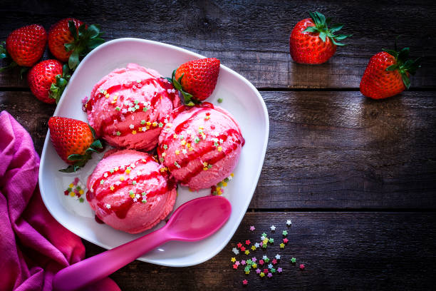 istock Strawberry ice cream shot on rustic wooden table. Copy space 1173381957