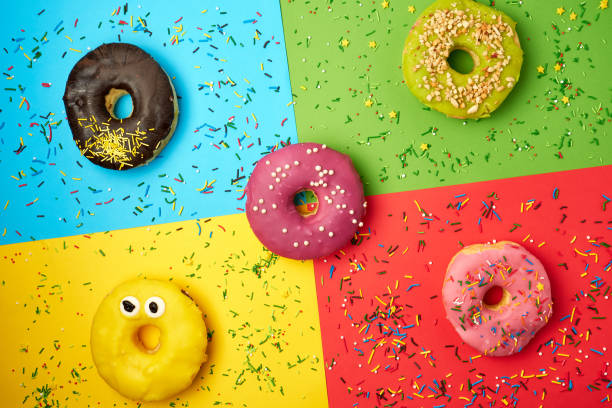 istock round donuts with various fillings and sprinkles 1173382189