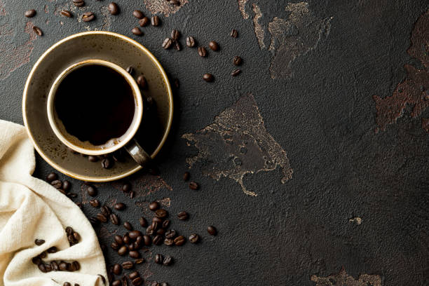 istock coffee and beans on a dark old table with copy space for your text 1173383549