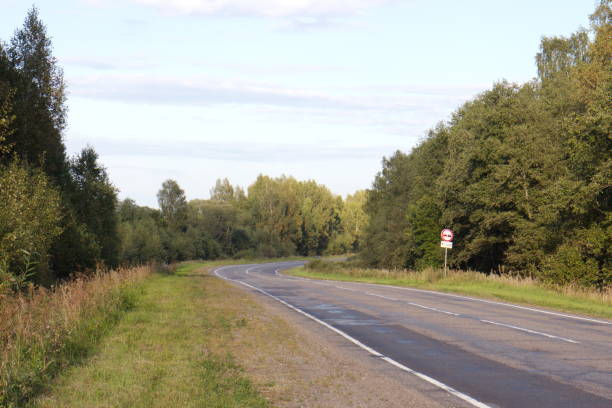 istock road in the countryside on a summer evening 1173387583