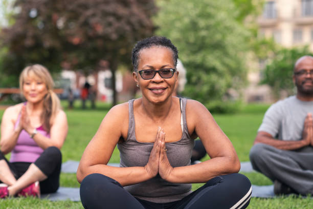 istock Multi-ethnic group of seniors meditating outdoors 1173388220