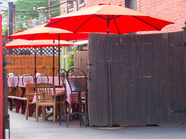 istock Sidewalk Cafe with red umbrellas 1173388878