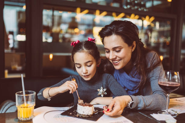 istock Family eating in restaurant 1173393840