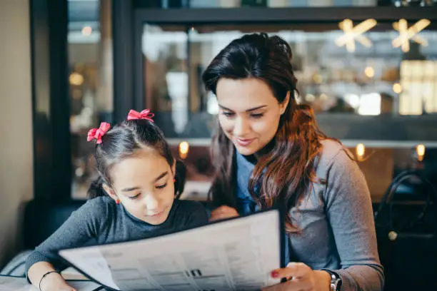 Photo of Mother and daughter in restaurant