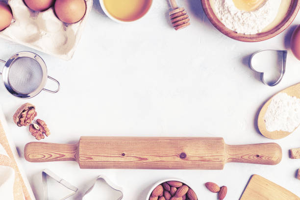istock Ingredients for baking  - flour, wooden spoon, rolling pin, eggs. 1173395626