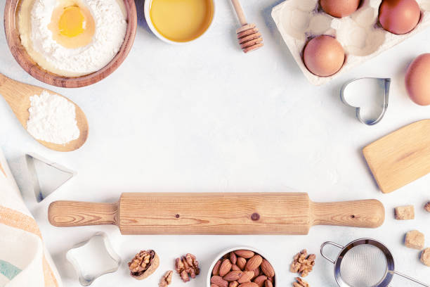 istock Ingredients for baking  - flour, wooden spoon, rolling pin, eggs. 1173395901