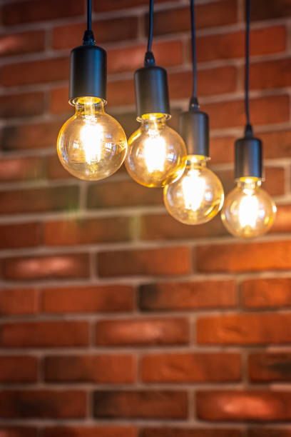 istock old brick wall and four old lamps close-up, background 1173395999