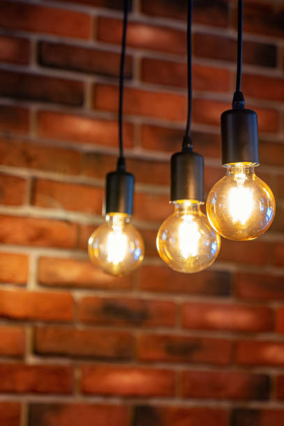 istock old brick wall and three old lamps close-up, background 1173396307