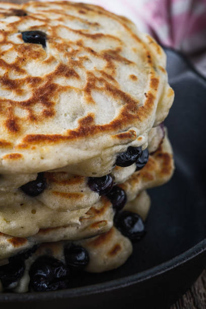 istock Blueberry pancakes in cast iron skillet 1173396354