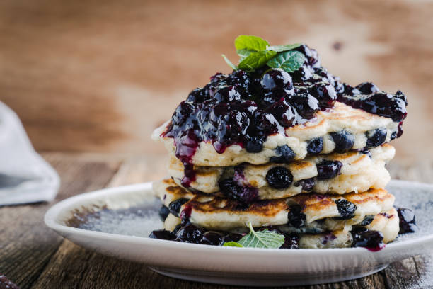 Breakfast or brunch, fresh summer pancakes with blueberries