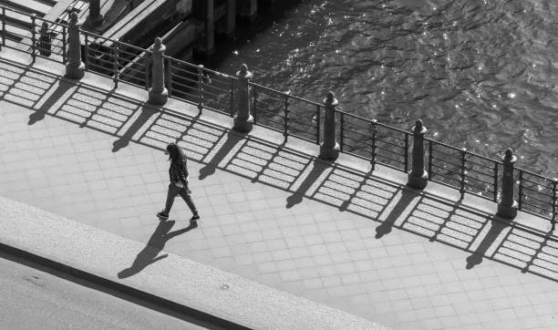 istock High Angle View Of Woman Walking On Bridge Over River 1173397320