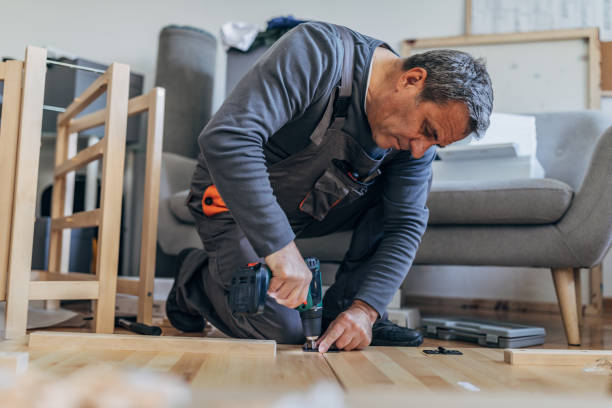 istock Senior carpenter putting together wooden table 1173400731