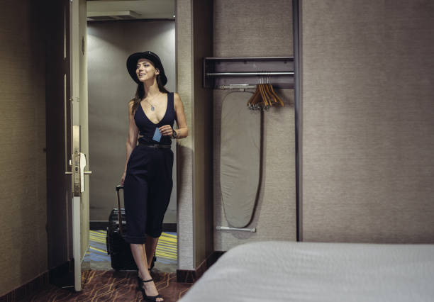 istock Young woman in hotel looking for room 1173400851