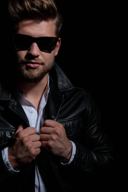 istock cutout image of a cool  man holding leather jacket's collar 1173403018