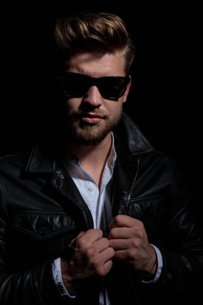 istock portrait of a serious young man in leather jacket 1173403034
