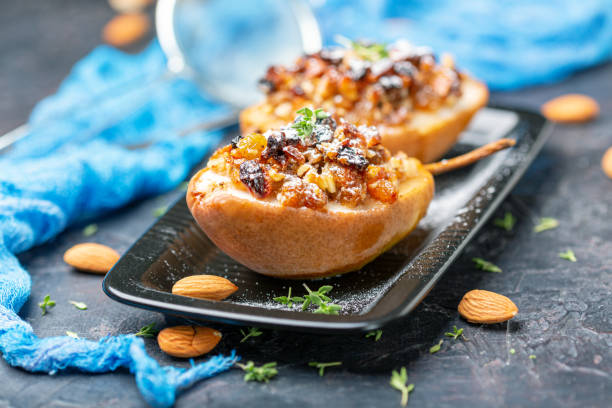 istock Baked pear with raisins, nuts and honey. 1173403090