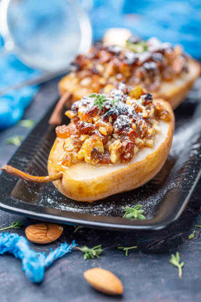 istock Delicious baked pears with nuts and raisins. 1173403306