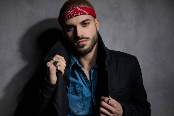 Portrait of a young handsome man posing in studio. About 25 years old, Caucasian man.