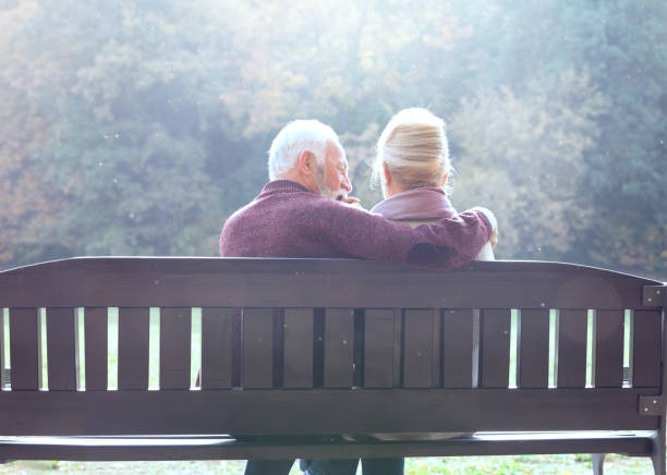 istock Romantic senior couple enjoy in autumn park 1173404871