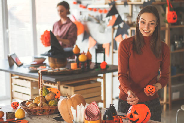istock Decorating the house for Halloween with bats and pumpkins 1173405889