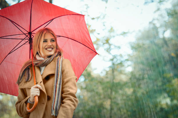 istock Nice young woman enjoy in rain. I like a rain ! 1173406186