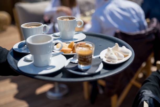 Waiter serving fresh coffee outdoors, Nikon Z7