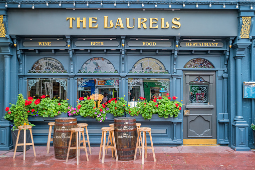 Ornate facade of a pub restaurant in downtown Killarney, Ireland.