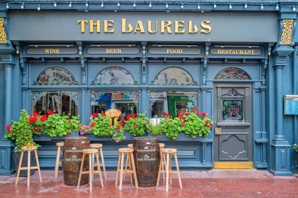 Pub Restaurant in downtown Killarney Ireland Ornate facade of a pub restaurant in downtown Killarney, Ireland. county kerry photos stock pictures, royalty-free photos & images