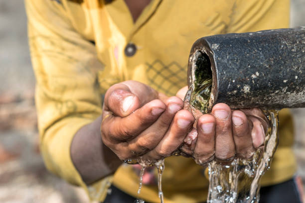 istock a young thirsty boy is drinking clean and sweet water 1173410753