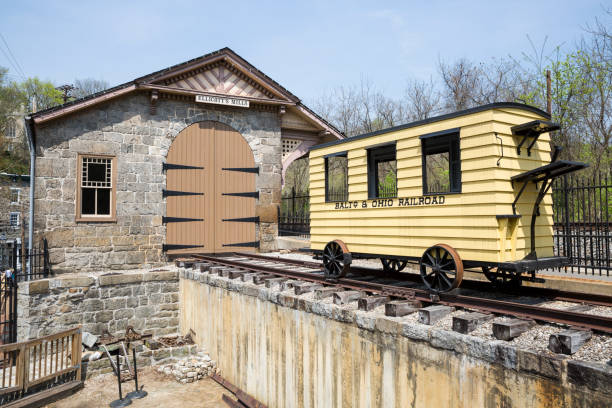Old Ellicott City Maryland Railroad Station Old Ellicott City Maryland railroad station with old yellow train card sitting on the tracks. ellicott city maryland stock pictures, royalty-free photos & images