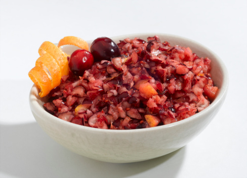 A cranberry orange relish in a while bowl.