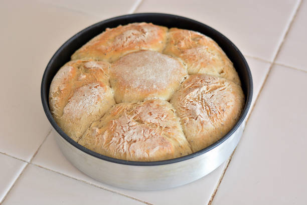 istock Freshly baked tin-shaped homemade bread on the tile. 1173414051