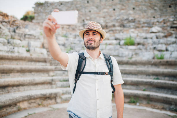 istock Tourist taking selfie at ancient theatre 1173415465