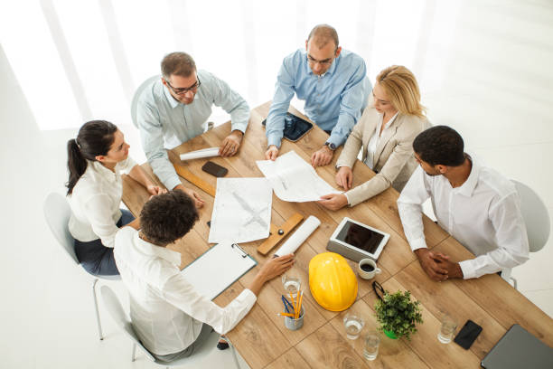 istock Aerial view of multi ethnic engineers discussing 1173415688