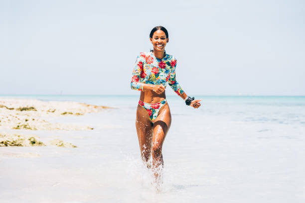istock Young Black woman at tropical beach 1173416492