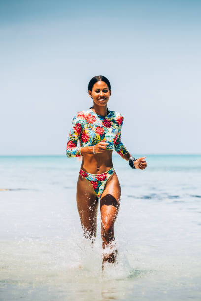 istock Young Black woman at tropical beach 1173417061