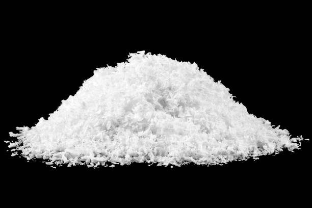 istock Heap of white snow isolated on black background 1173419548