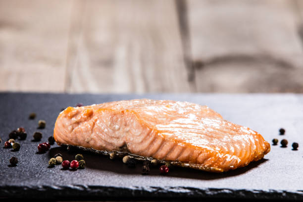 istock Roasted salmon steak on stone plate 1173419550