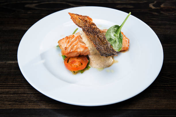 istock Salmon steak with creamy sauce 1173425224