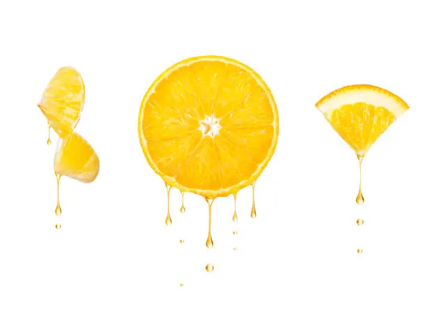 Drops of juice drip from cut pieces of orange, isolated on white background