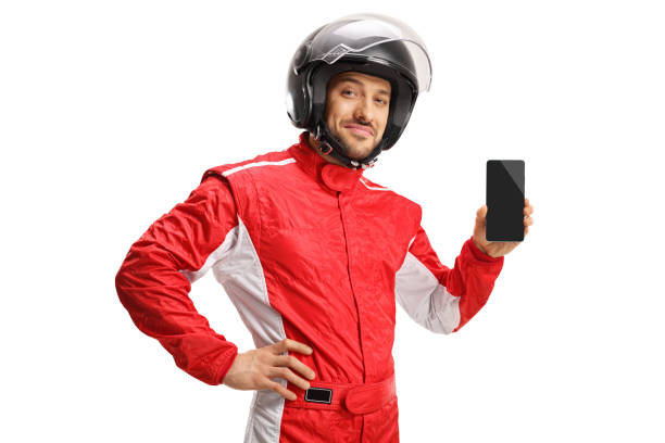 istock Car racer with a helmet holding a smartphone 1173429404