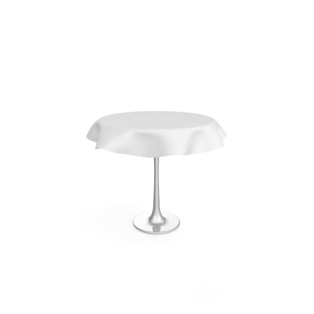 istock Round metal table with white tablecloth. There is room for Your design. Isolated white background 1173431202