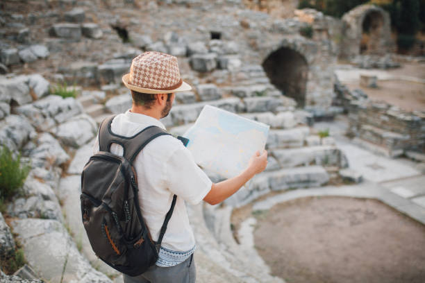 istock Tourist sitting at ancient theatre 1173431419