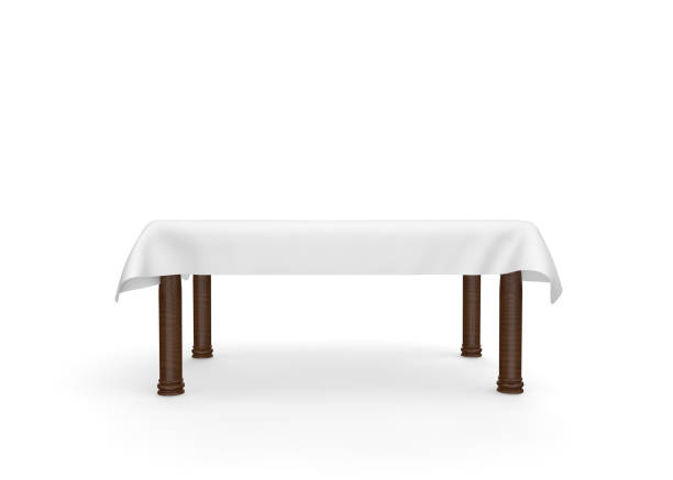 istock A rectangular wooden table with a white tablecloth. There is room for Your design. Isolated white background 1173431514