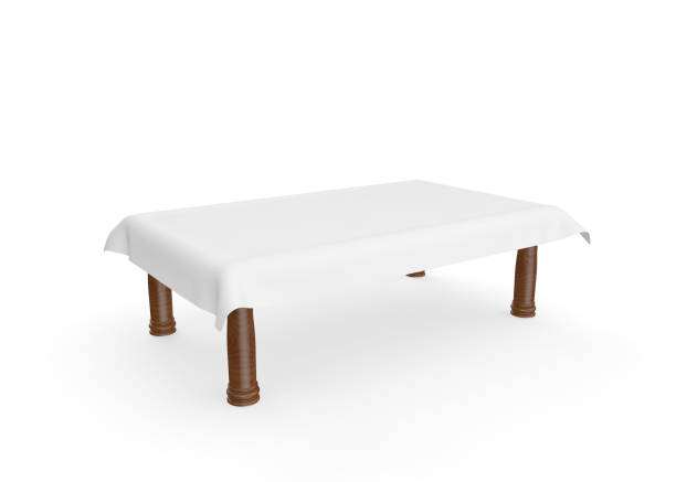 istock A rectangular wooden table with a white tablecloth. There is room for Your design. Isolated white background 1173431524
