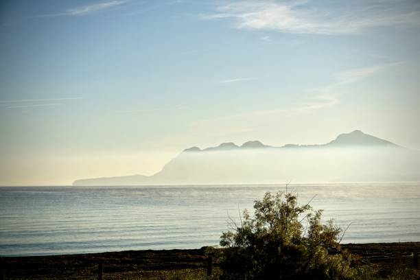 istock foggy sunrise on ocean in Spain 1173436979