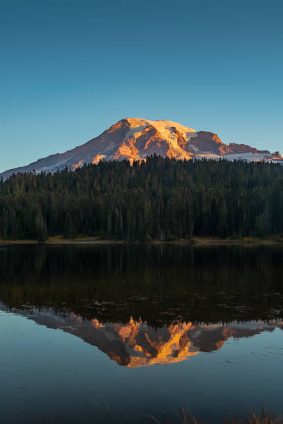istock Dawn Breaks Over Peak of Mount Rainier 1173440154