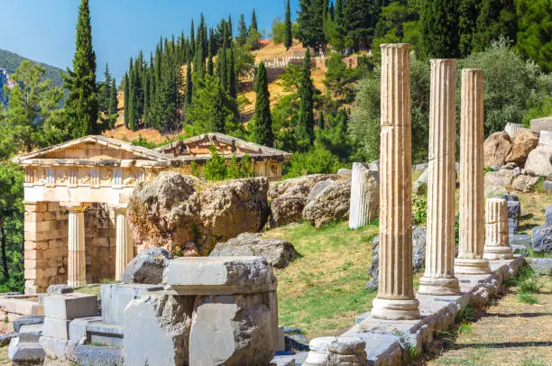 Ancient city of Delphi with ruins of the temple of Apollo, the omfalos (center) of the earth, theater, arena and other buildings, Greece