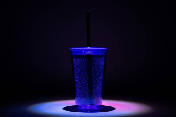 istock Cocktail glass, drinks in plastic cup with black straw 1173447562