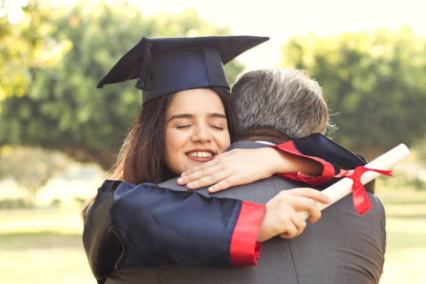 istock Graduation Day Father Proud Hugging Concept 1173448405